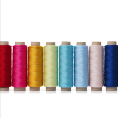 Collection of sewing thread spools isolated on white background