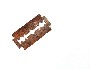 Close-up image of a rusty, old and unused razor blade