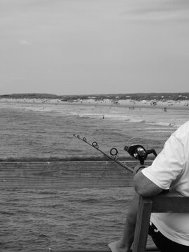 man fishing on the beach