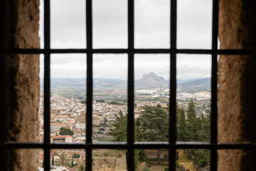 View of a mountain in Antequera, Spain, seen from inside from alcazabas`s dungeon cell, blending...