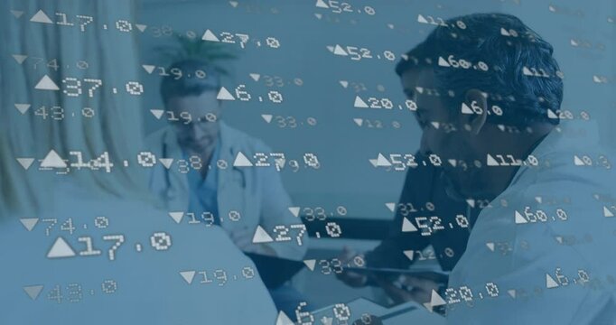 Blue-tinted numeric overlay appearing driving medical team with tablet discussing financial figures - Powered by Adobe