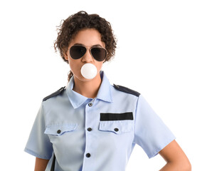 African-American female police officer blowing bubble gum on white background