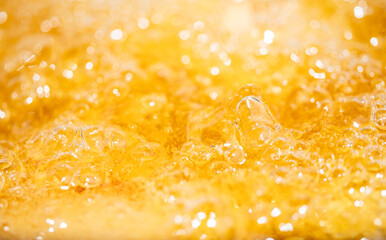 Close up bright orange Oil or beer splash texture and nature waves, Beautiful waves curve and...