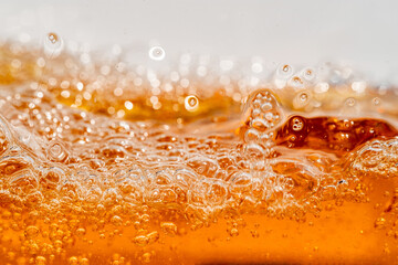 Close up bright orange Oil or beer splash texture and nature waves, Beautiful waves curve and...