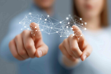 Two professionals pointing at a screen with only two data nodes highlighted Visualizing ethical collaboration in digital strategy