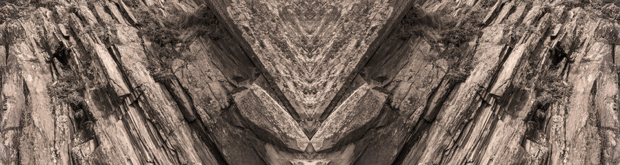 Background of layers and cracks in stone rock, long banner. Natural stone background or stone texture.
