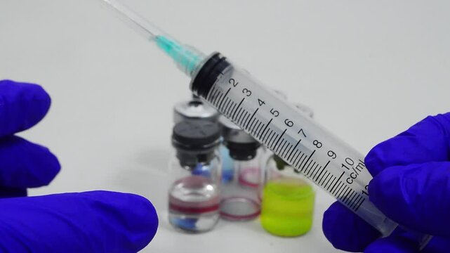 insulin syringe and vial with medicine for injection on white background copy space, vaccination concept
