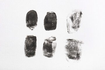 Black finger prints on white background
