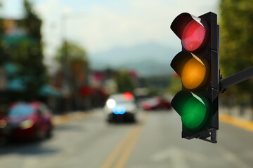 Traffic lights on city road. Signaling device
