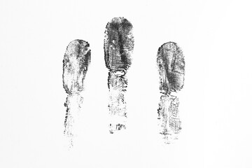 Black finger prints on white background