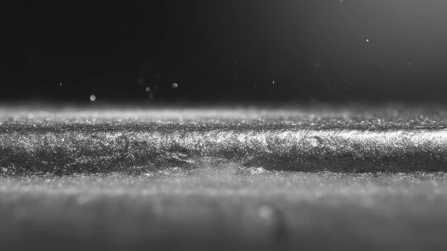 Microscopic droplets interacting with textured zinc bromide layer, revealing intricate surface dynamics through precise ultrasonic mist dispersion
