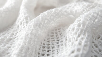 Obraz premium Close-up of White Knitted Fabric with Delicate Texture