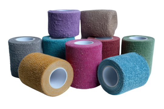 Colorful Cohesive Bandage Rolls: A captivating view of colorful cohesive bandage rolls, a symbol of support, care, and professional treatment, are meticulously arranged in an array.