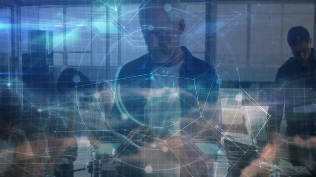 Team leader tapping tablet initiating overlay while team analyzing data flow for business planning - Powered by Adobe