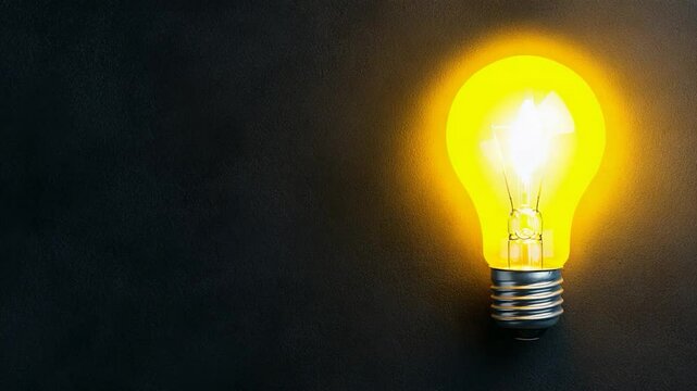 Glowing Light Bulb on Dark Background: Idea, Innovation, and Inspiration