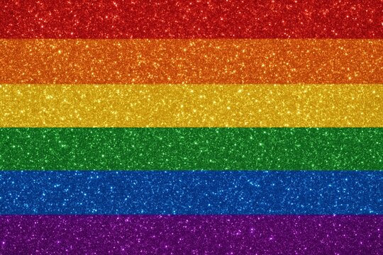 Vibrant sparkling rainbow glitter background in pride flag colors