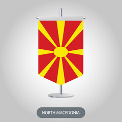 North Macedonia vertical table flag on light grey background. North Macedonia vertical desk flag isolated on grey background	
