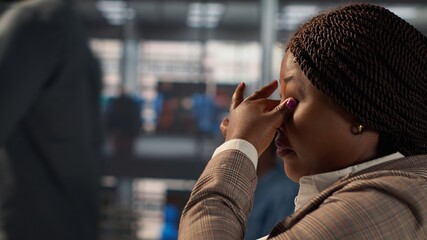 Black CEO feeling tired and working under pressure at the office, search ways to increase funds and...
