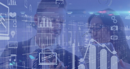 Image of icons and financial data over caucasian businesspeople working in office