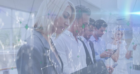 Image of connections and lights over caucasian businesspeople using tech devices