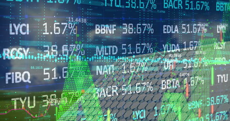 Image of financial data and graphs over solar panels