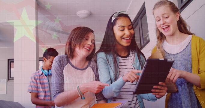 Naklejki Image of flag of china over happy diverse girls using tablet at school