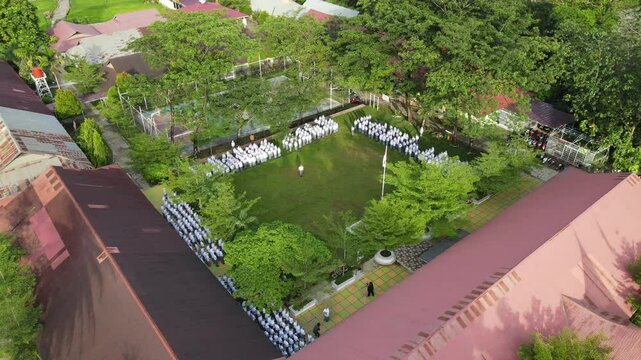 Aerial Drone View of Senior High School Students Performing Upacara Bendera (Flag Ceremony) Outdoors in Padang, Indonesia