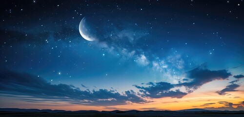 Crescent Moon in Starry Night Sky above Horizon