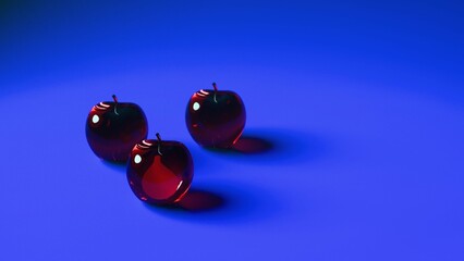 Three glass red apples on gradient blue surface....