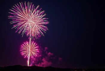 Vibrant fireworks burst against a dark, rough-textured night sky,  sparks,  dark