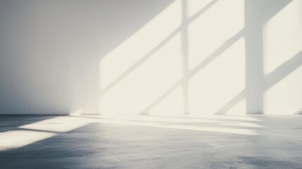 A white wall with large, rectangular windows casting shadows on it.