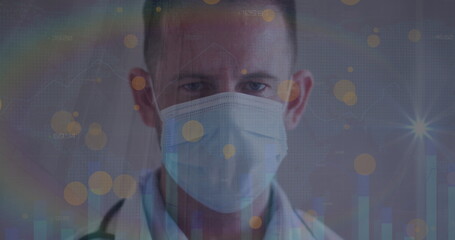 Image of data processing over caucasian male doctor with face mask