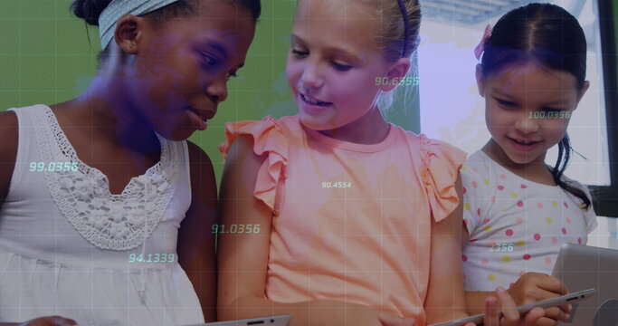 Using tablets three schoolgirls collaborating at classroom desk, with digital grid overlay