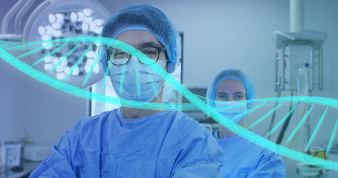 Image of dna strand over diverse surgeons with face masks