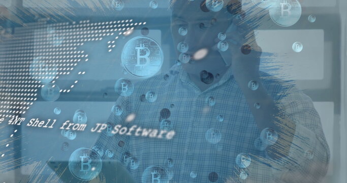 Image of data processing and bitcoin symbols over caucasian man - Powered by Adobe