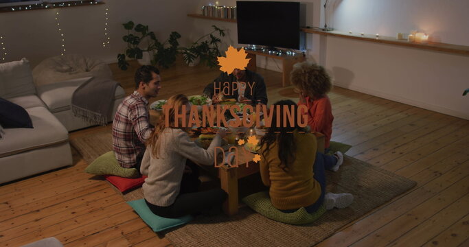 Image of happy thanksgiving day text over happy diverse friends eating