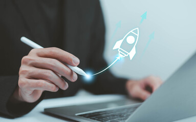 Startup business start-up with technology background as a rocket image conveying the idea of ​​launching a well-planned new business.	
  
