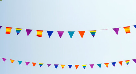 Obraz premium Rainbow Pride Flags Hanging Against a Clear Blue Sky