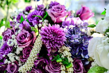 Beautiful flowers bouquet in different color tone and styles in Thailand market, nice background textures. Thai orchids, roses, carnations etc. Close up shot.