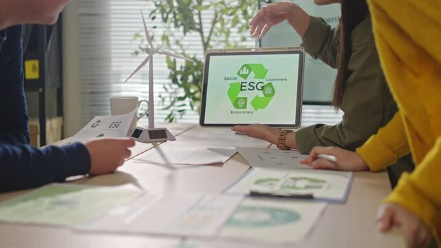 Asian business team discussion reusable product in office,start up eco-friendly business,environmental protection,sustainable business model,ESG strategy,sustainability,team meeting,ESG Report concept