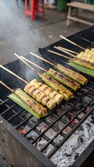 Juicy Otak Otak Fresh Off the Grill Steaming on Banana Leaf with Dark Char Spots