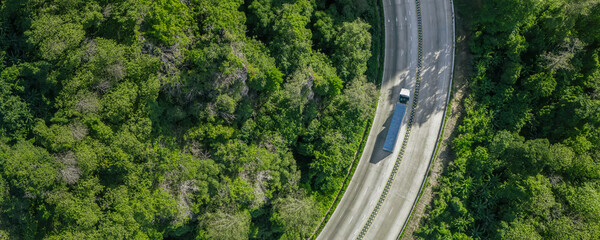 Green logistic or Sustainable transport. Sustainable global transport. Environmentally friendly freight trucks. Clean energy and environmentally friendly processes towards net zero carbon emissions. © Dee karen