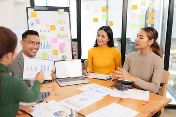 Group of Asian business people working together in an office