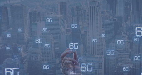 Image of 6g and hand of caucasian woman with bulb over cityscape