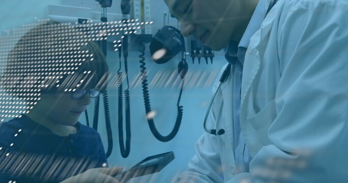 Data processing against asian male doctor teaching to use magnifying glass to caucasian boy