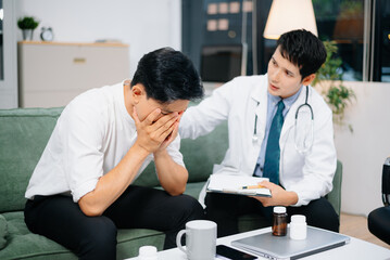Fototapeta premium Doctor Comforts Stressed Male Patient During Mental Health Consultation