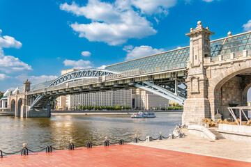 Fototapeta premium View of the Moscow river embankment, Pushkinsky bridge and cruise ships at sunset.