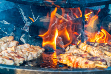 Steak on the grill with flames