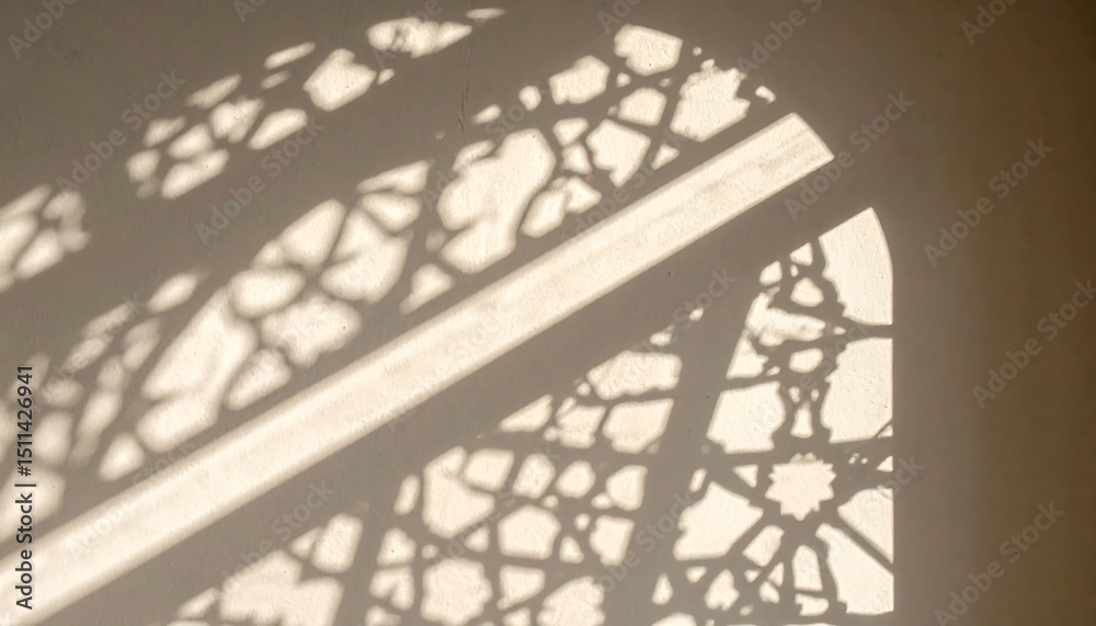 Poster window shadow patterns on white wall.