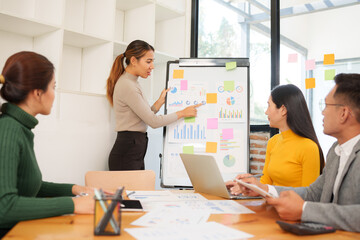 Group of Asian business people working together in an office